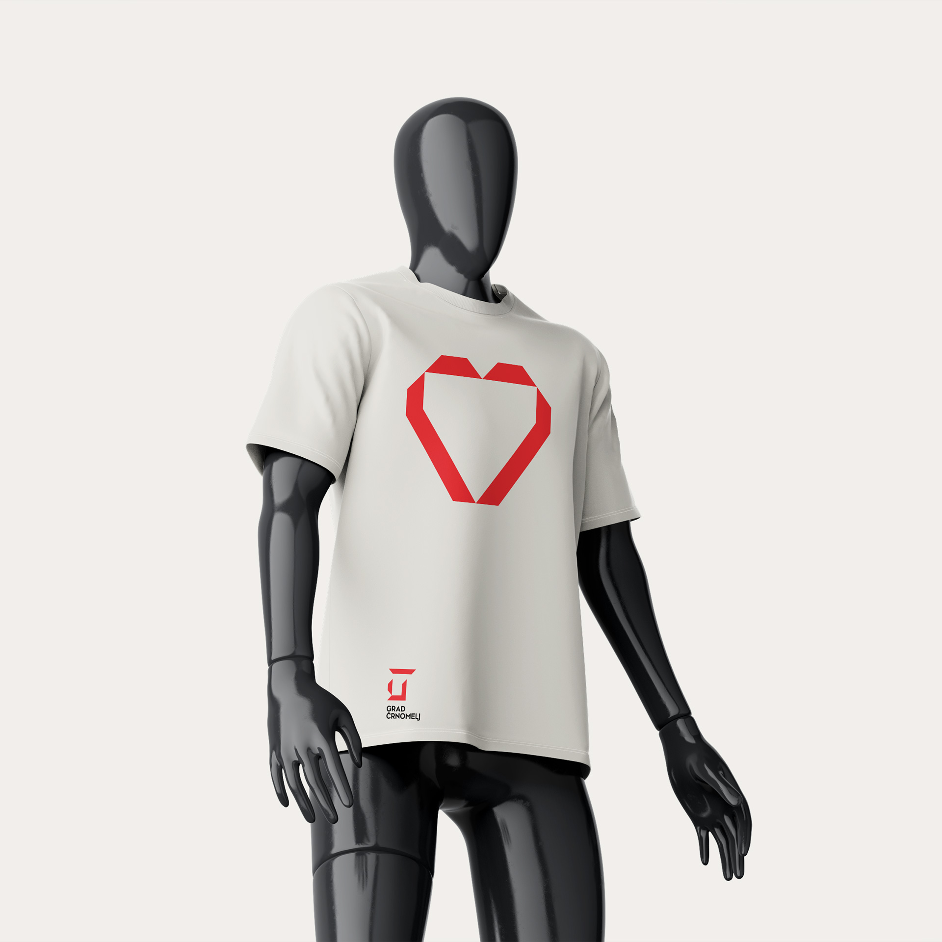 Grey short-sleeved T-shirt featuring a stylised red heart motif and the Črnomelj Castle logo.