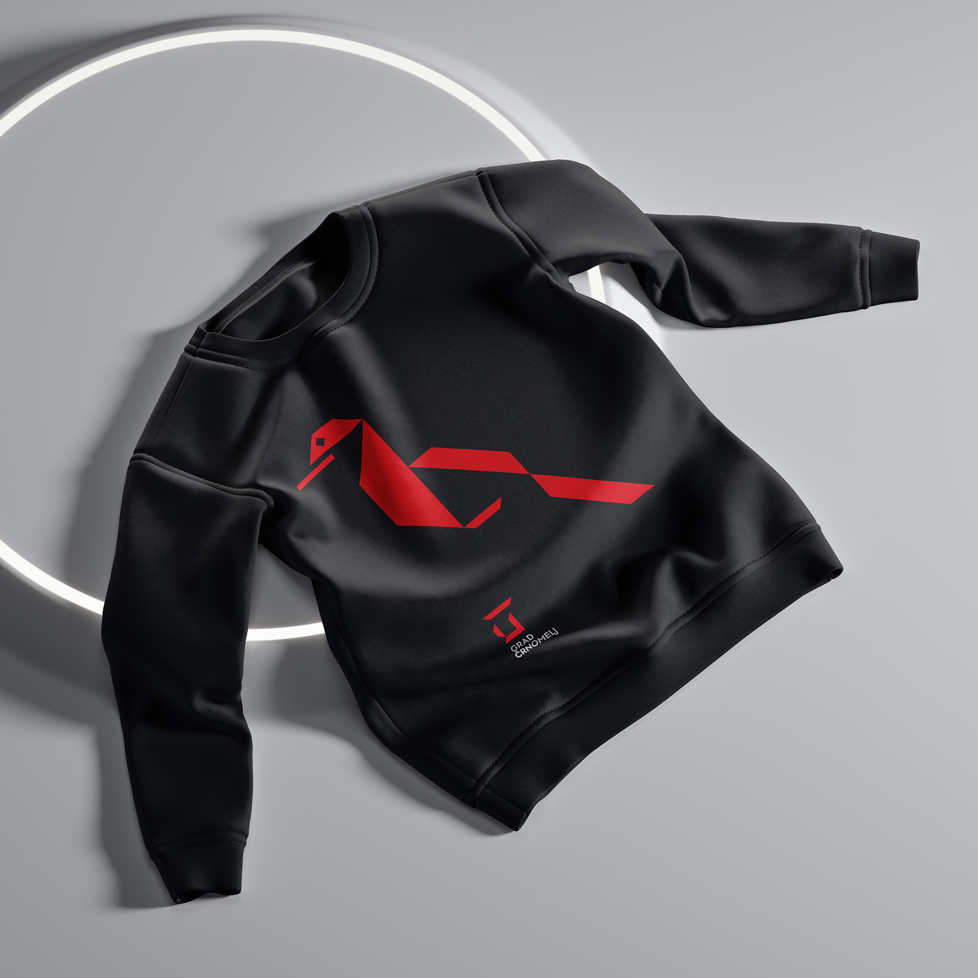 Black long-sleeved T-shirt featuring a stylised bird motif and the Črnomelj Castle logo.