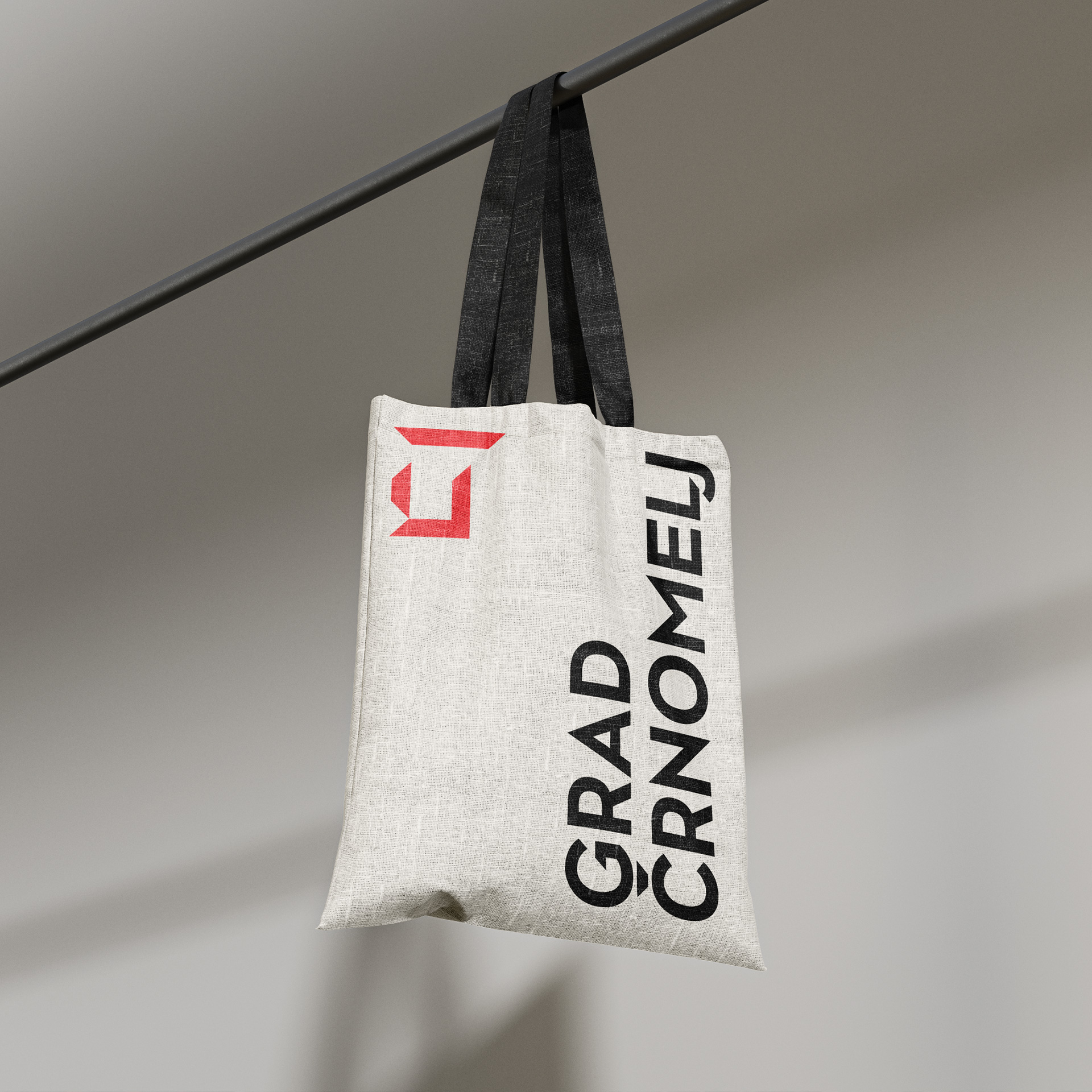 Grey canvas bag with black handles, featuring the inscription “Črnomelj Castle” and the castle logo.