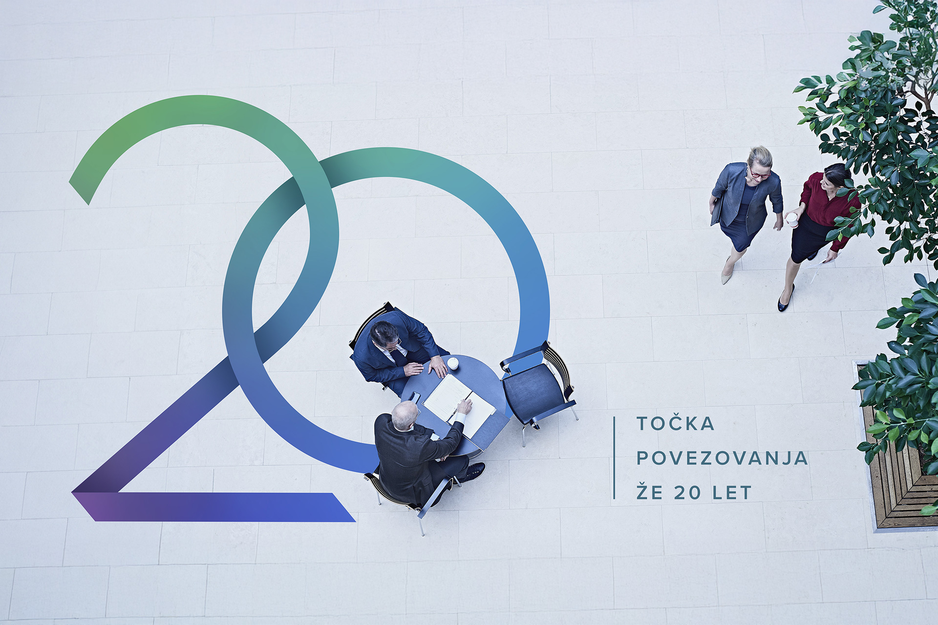 A bird’s-eye view. Two businessmen are sitting at a table, while two businesswomen are walking by. A large number 20 and the caption “ Connecting point for 20 years” appear in the image.